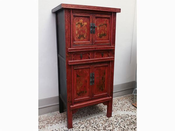 An asiatic red laquered cabinet