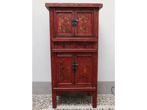 An asiatic red laquered cabinet