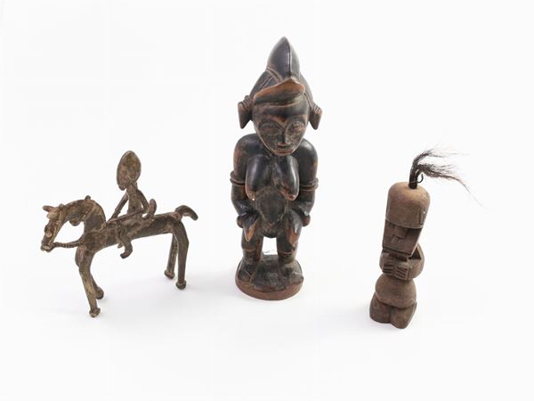 Three wood and bronze tribal figures