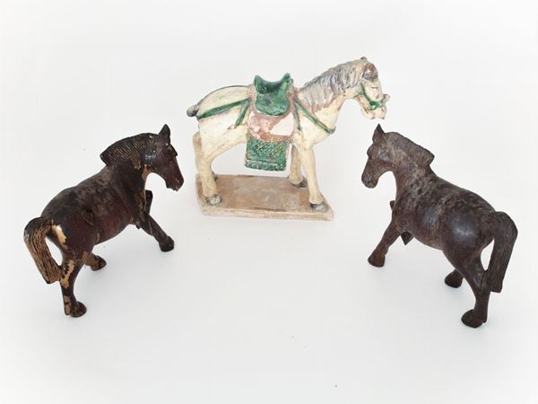 Three wood and terracotta horses, oriental manufacture