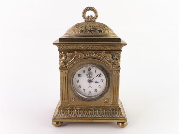 A brass carriage clock  (begin of 20th century)  - Auction House Sale: Furniture and Paintings from Villa Roseto  - Florence - II - II - Maison Bibelot - Casa d'Aste Firenze - Milano
