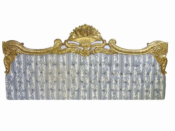 A giltwood kingsize headboard  - Auction Antiquities, Interior Decorations and Vintage  from the Panarello Gallery in Taormina - Maison Bibelot - Casa d'Aste Firenze - Milano