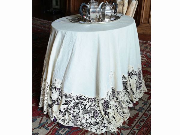 An ivory linen table cloth