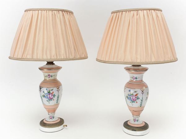 A couple of polychrome porcelain table lamps