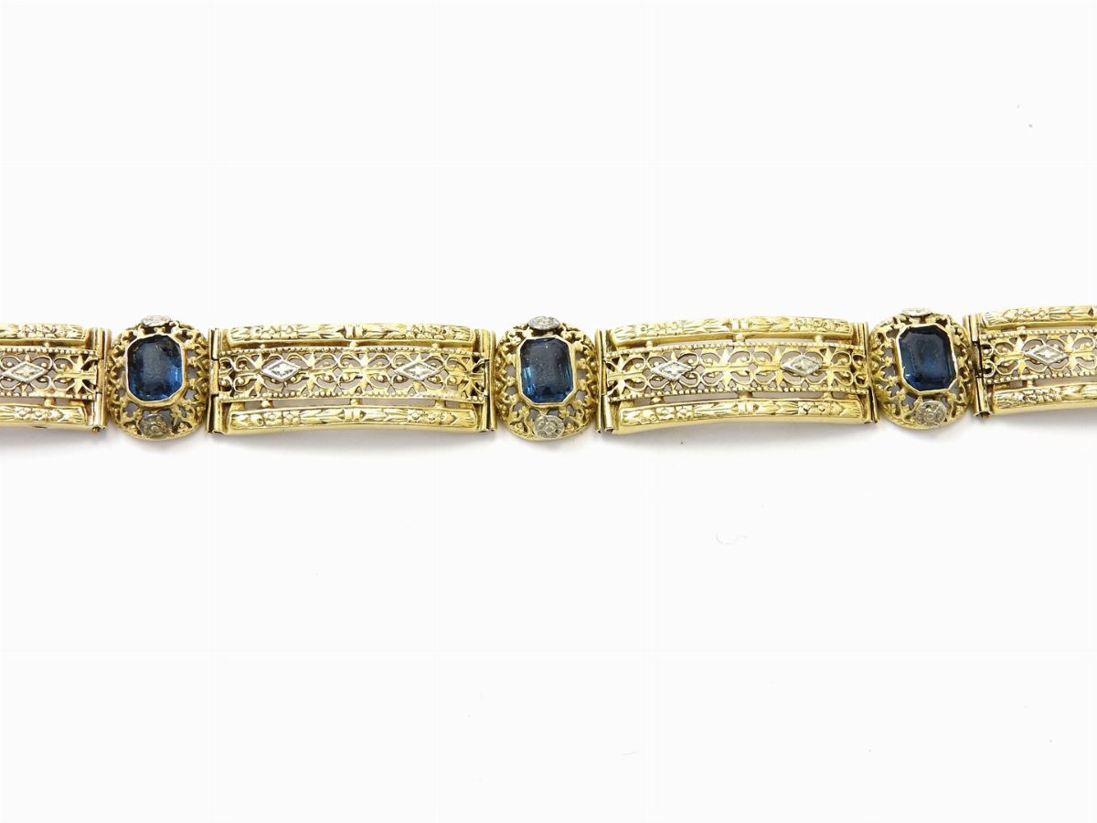 Bracciale in Oro Giallo 585/1000 e Anello in Oro Giallo e Argento con Diamanti e Pietre Artificia...