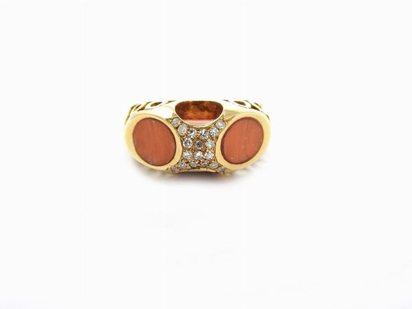 Yellow gold ring with diamonds and orange coral