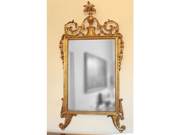 Carved and gilded wooden mirror