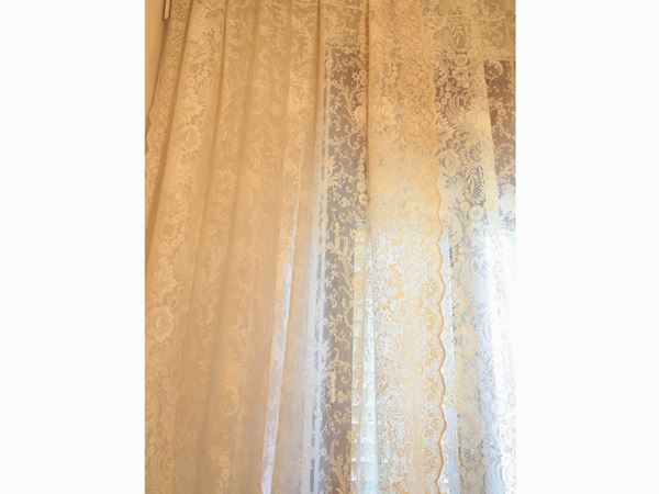 A couple of mechanical lace curtains