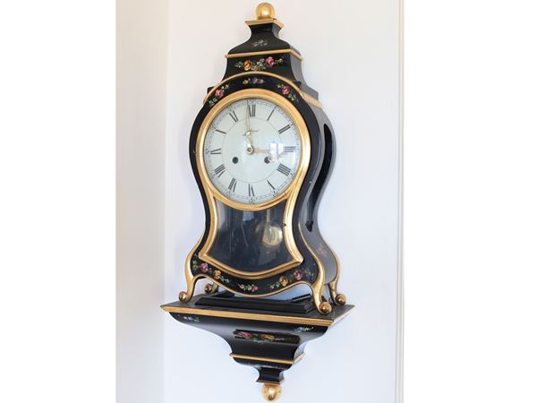 A gilded and ebanyzed table clock