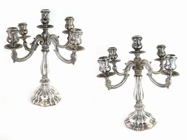 A couple of silver candelabras