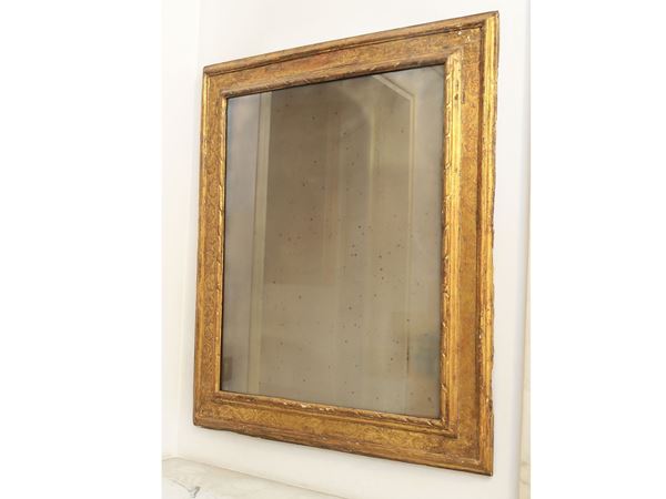 A giltwood and pastiglia frame with mirror