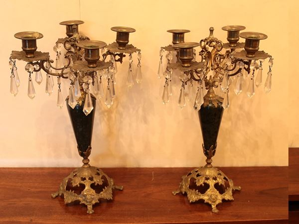 A couple of gilded metal candelabras