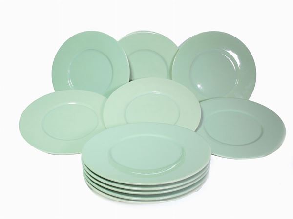 A group of eleven charger plates