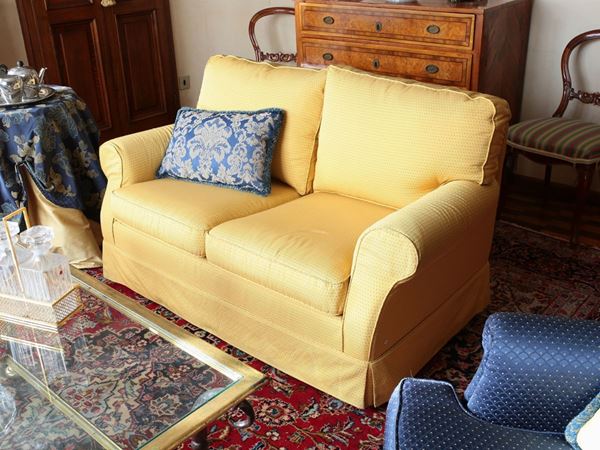 A yellow fabric sofa