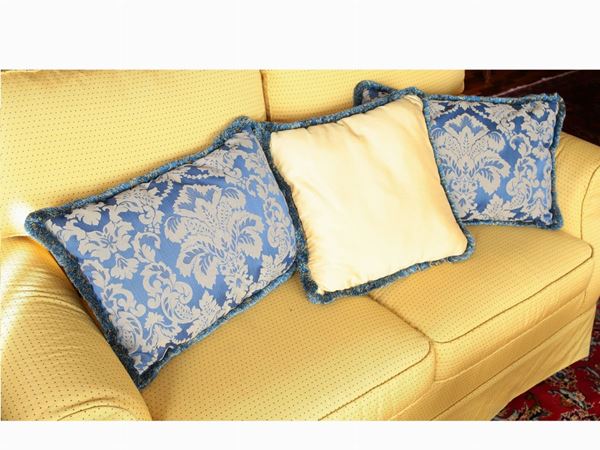Five silk and damask fabric pillows