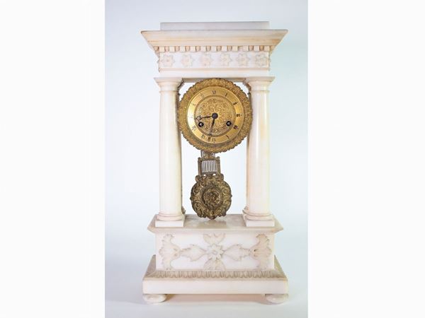 An alabaster fireplace clock