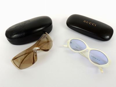Quattro Paia di Occhiali da Sole, Gucci, Emporio Armani e Versace