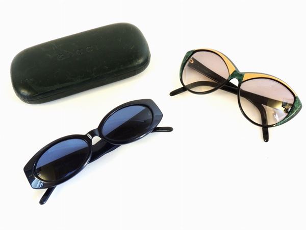 Quattro paia di occhiali da sole, Gucci, Dolce e Gabbana e YSL