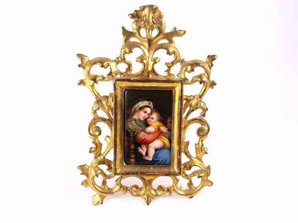 A small giltwood frame with miniature on porcelain