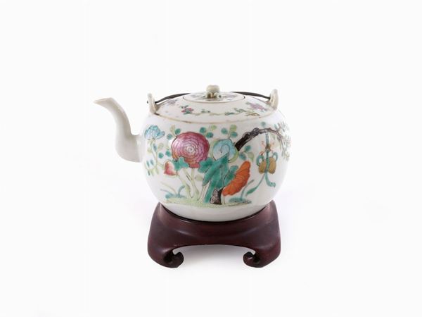 A polychrome porcelain tea pot