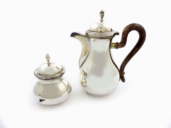 Silver coffepot and sugar bowl