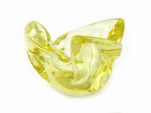 A yellow blown crystal bowl