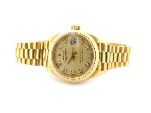 Yellow gold Rolex ladies wristwatch with diamonds
