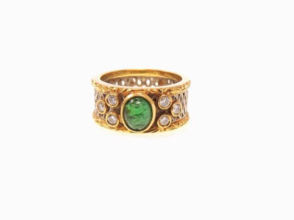 Yellow and white gold band ring with diamonds and emerald