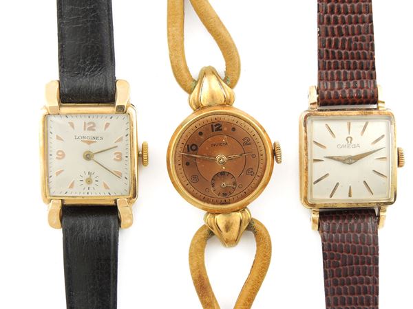 Three yellow gold Omega, Longines and Invicta ladies wristwatches