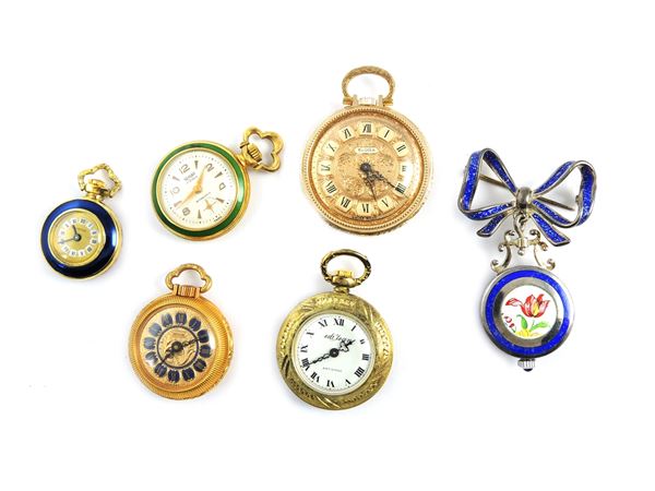 Six metal ladies small pocket watches and one item with silver pin