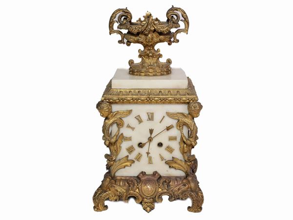 A monumental ormolu and white marble clock