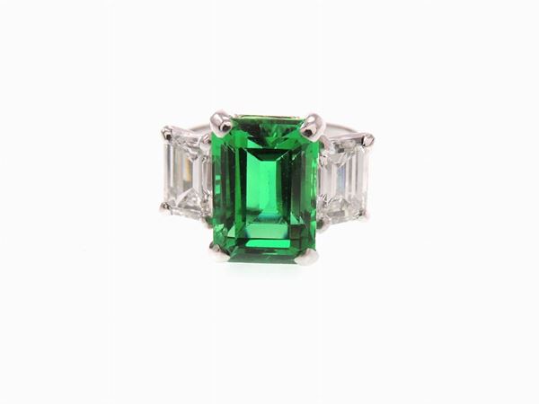 White gold ring with diamonds and Columbian emerald