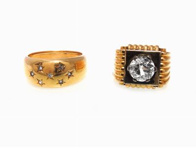 Due Anelli in Oro Giallo e Argento con Pietre Incolori