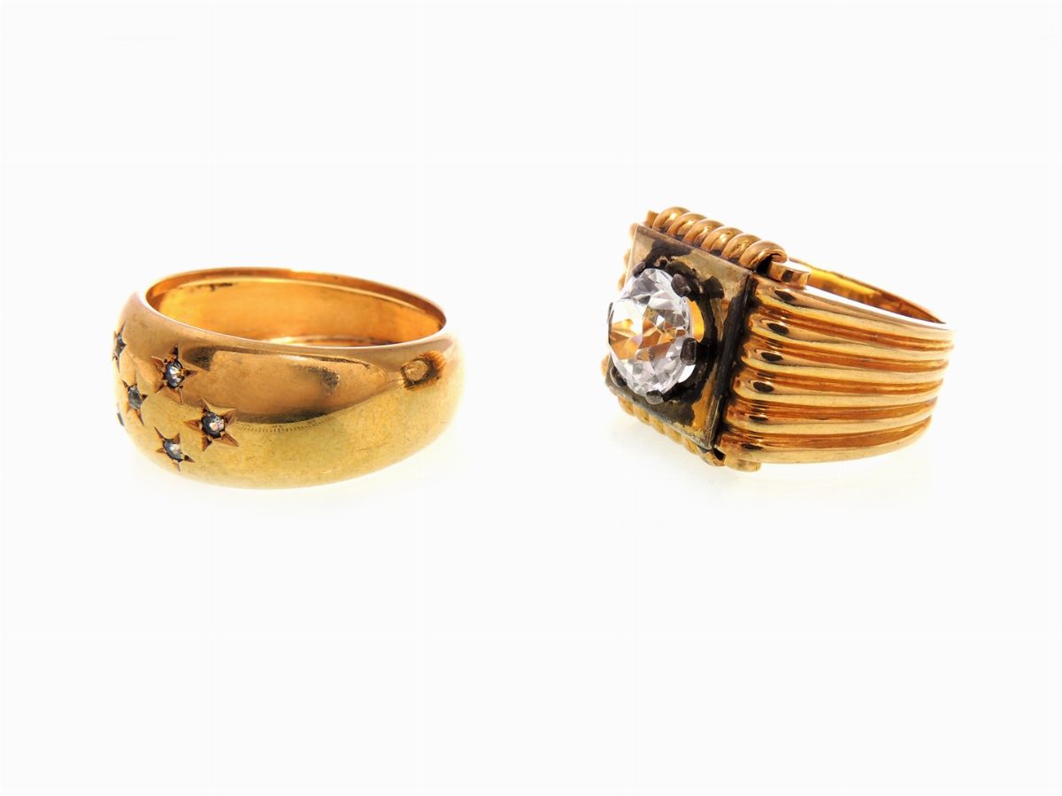 Due Anelli in Oro Giallo e Argento con Pietre Incolori