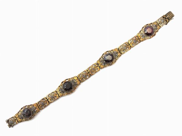 Yellow gold and silver bracelet with garnets