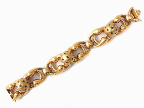 Yellow gold bracelet with sapphires