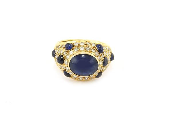 Yellow gold domed ring with diamonds and sapphires