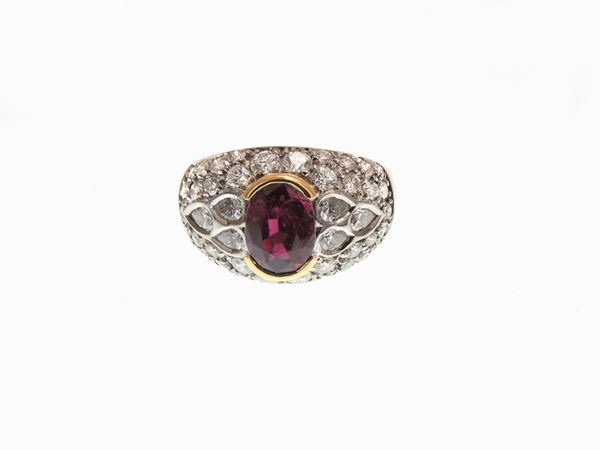 White and yellow gold ring with diamonds and ruby