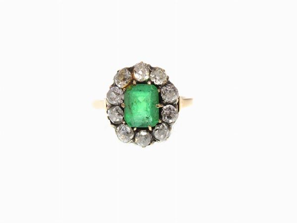 Low alloy yellow gold ring with diamonds and emerald