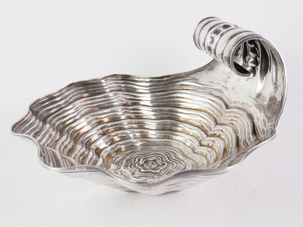 A silver seashell shaped centerpiece