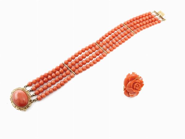 Demi parure of yellow gold bracelet and ring with orange red coral