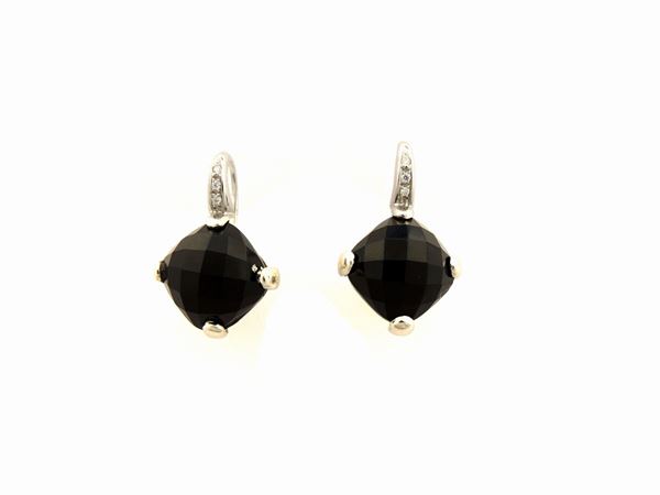 White gold earrings with diamonds and onyx