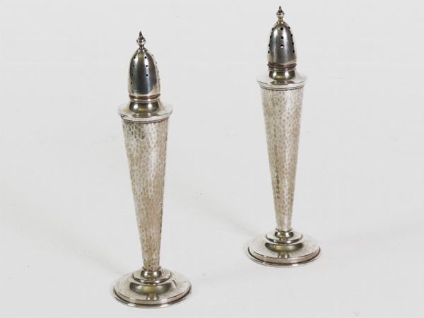 A pair of sterling silver salt and pepper shakers