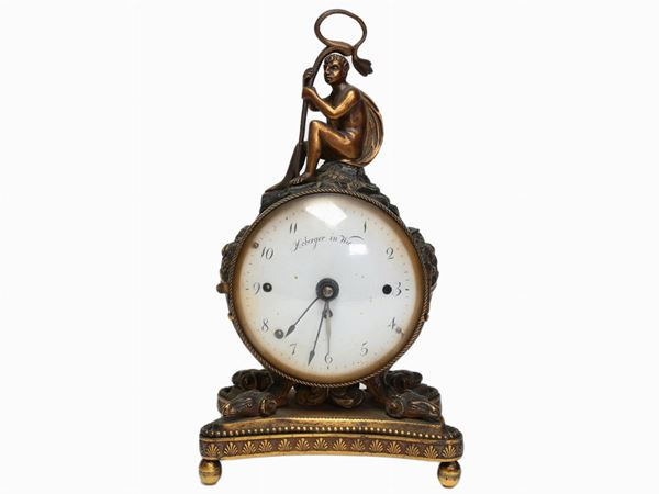 A gilted bronze table clock