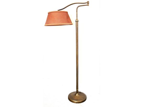 A wooden and brass reading lamp