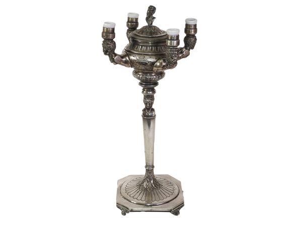 A silver oil lamp