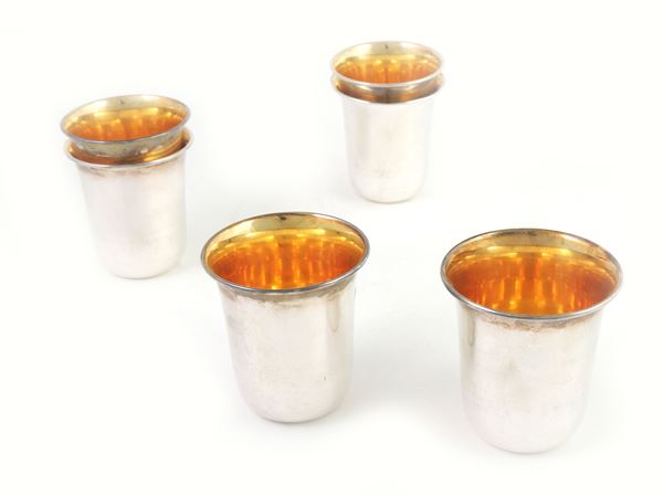 A set of six sterling silver tumbler glasses