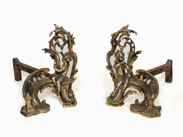 A pair of gilted metal andirons