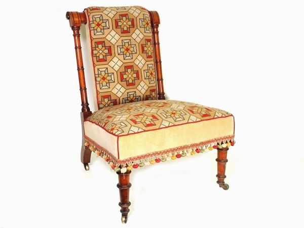 A cherrywood fireplace small armchair