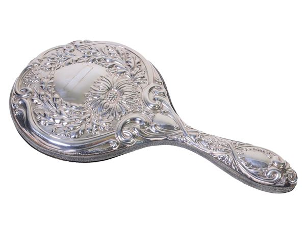A silver and velvet hand mirror